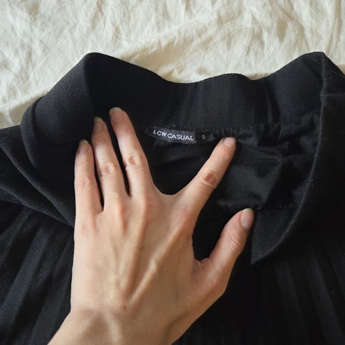 LCW Casual black pleated midi skirt with asymmetrical hem, size S