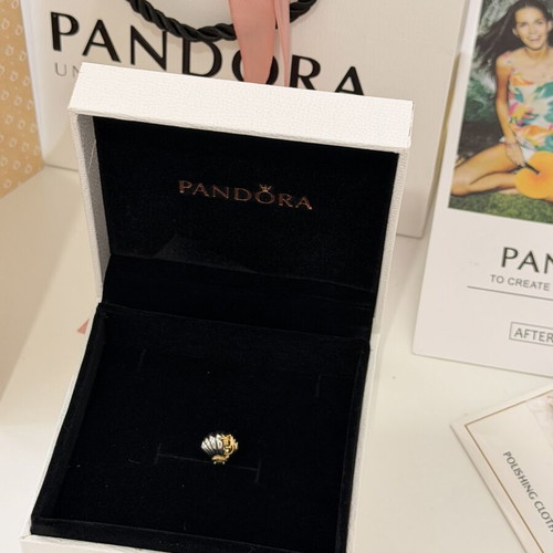 Pandora Ariel shell charm with diamond symbol