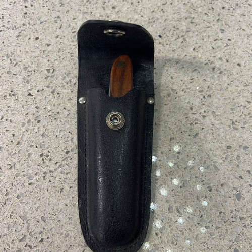 Folding knife used from 1980s with sheath