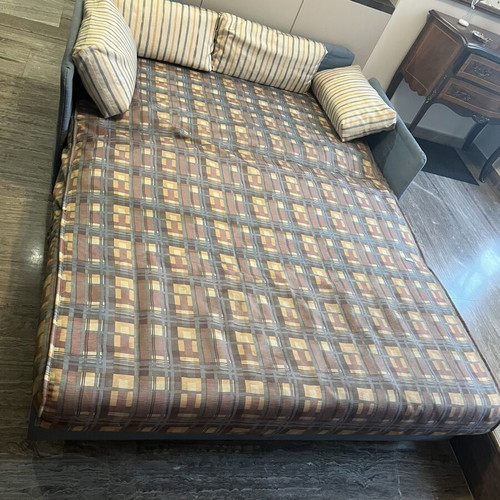 Two-Seater Sofa Bed used, practical and space-saving