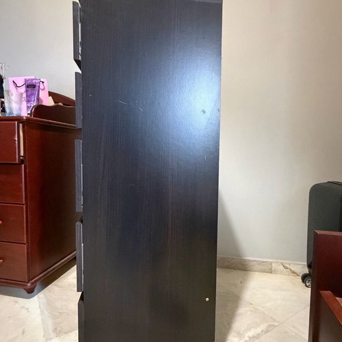 Dark brown wooden chest of drawers used with minimal wear
