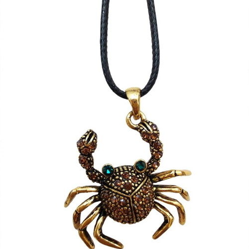 Crab pendant like new, dark gold with stones