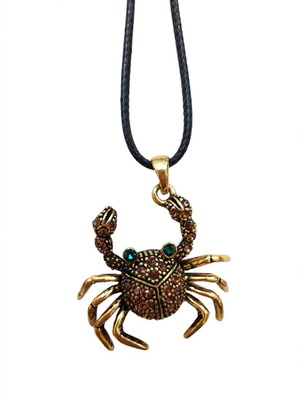 Crab pendant like new, dark gold with stones