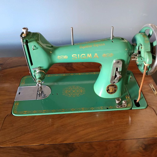Sigma sewing machine used with wooden cabinet and bar door
