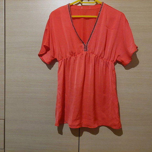 Coral satin-like blouse with V and rhinestones like new, size Medium