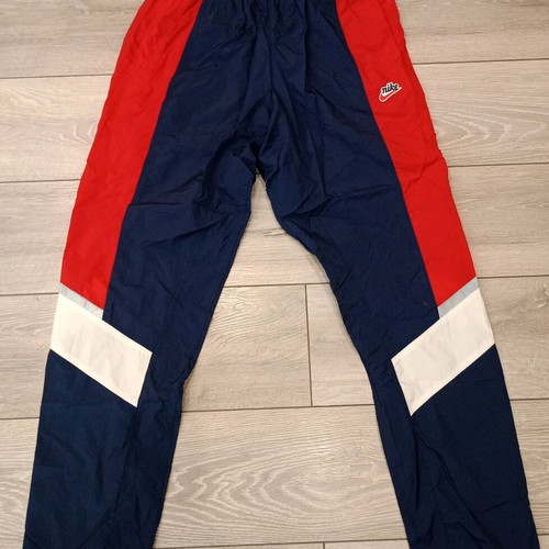 Nike track pants used, navy with red stripes