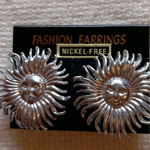 Clip-on earrings new, silver sun design