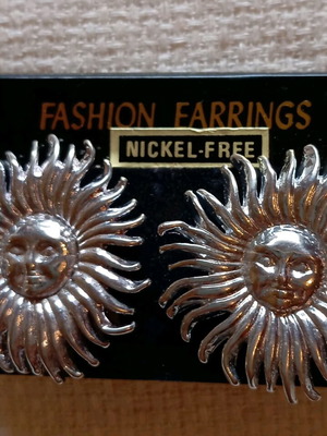 Clip-on earrings new, silver sun design