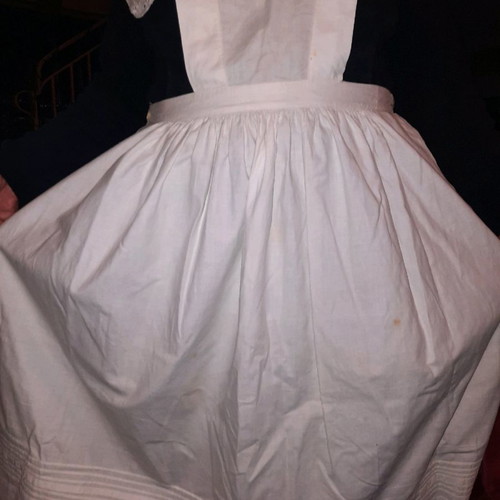 Traditional white kitchen apron with shoulders, buttons at back