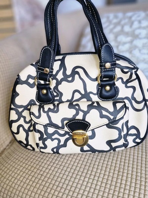 Tous handbag like new with black and white bear motif design