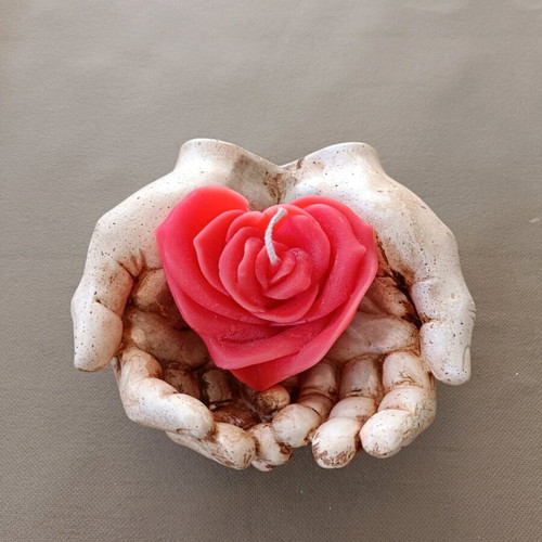 Decorative hands new, handmade art with candle heart rose