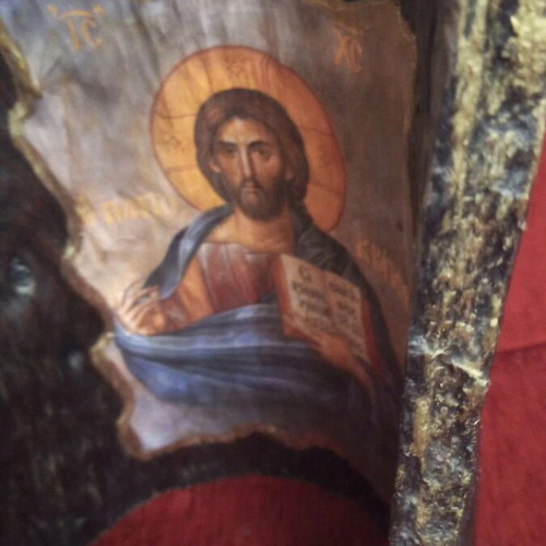 Christ image on tree trunk like new