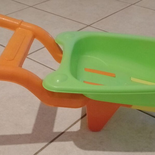 Beach toy set: plastic wheelbarrow, shovel, rake, small excavator