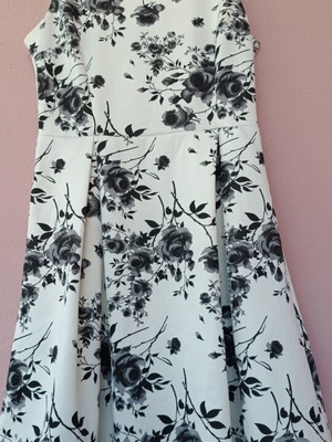 White fit and flare dress with black floral pattern