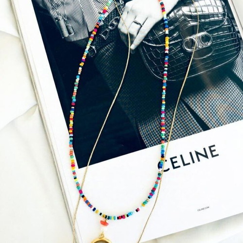 Steel necklace new with gold elements and colorful shells