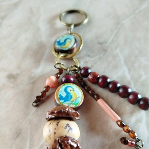 Purse charm keychain new, handmade with wood beads and almond shells
