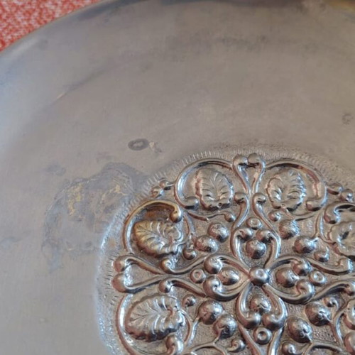 Silver-plated centerpiece bowl used with carved details and three feet