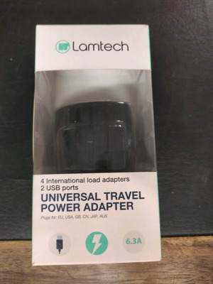Universal travel power adapter Lamtech new with 2 extra USB ports