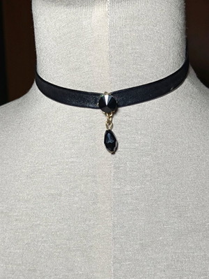 Necklace with leatherette ribbon