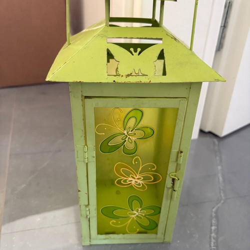 Green candle lantern used with rust spots