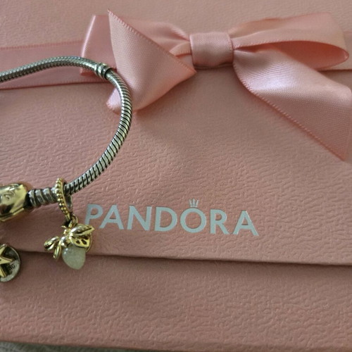 Pandora authentic bracelet like new with 3 gift charms silver and gold