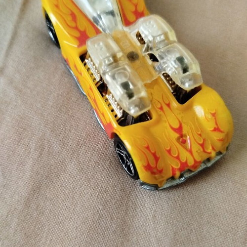 Hot Wheels metal toy car like new, yellow with orange flames by Mattel