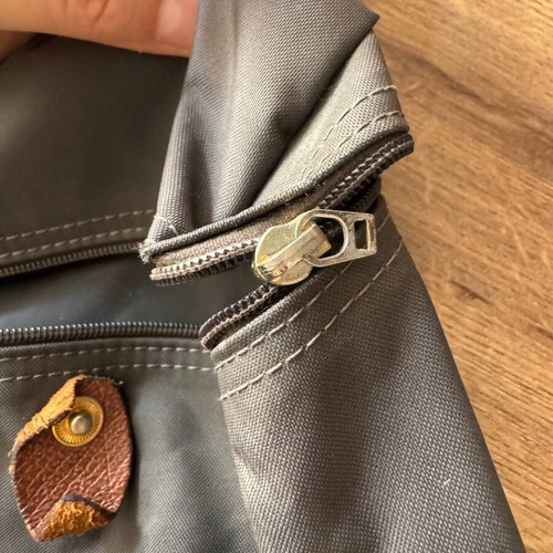 Longchamp backpack used, zipper needs repair, beige and gray