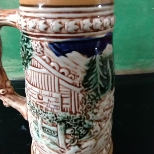 Decorative ceramic beer mug like new with embossed designs