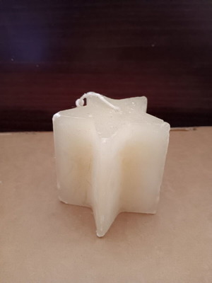 Star-shaped candle used, good condition