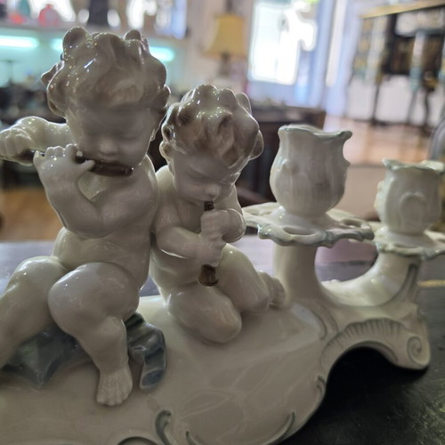 Hutschenreuther Selb porcelain four-light candelabra used, putti design