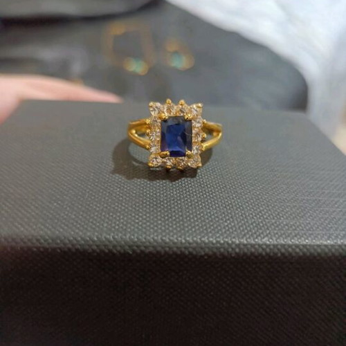 Gold-Plated Ring with Blue Stone and Elegant Setting