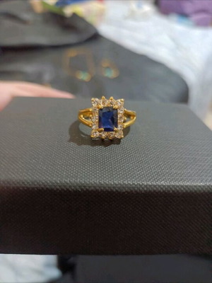 Gold-Plated Ring with Blue Stone and Elegant Setting