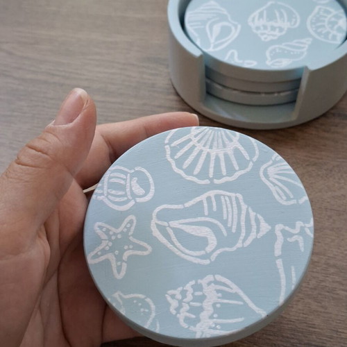 Handmade plaster coaster set with summer decoration and soft blue color