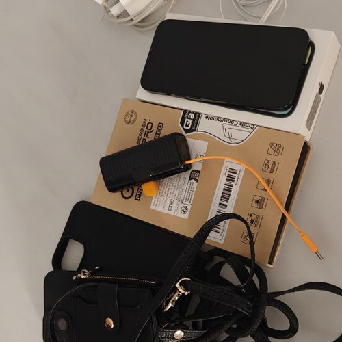 iPhone 13 128GB used with charger, earphones, cases, and power bank
