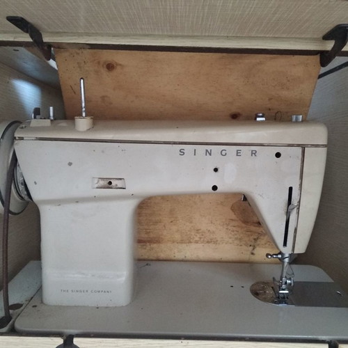 Singer sewing machine in cabinet used, functional