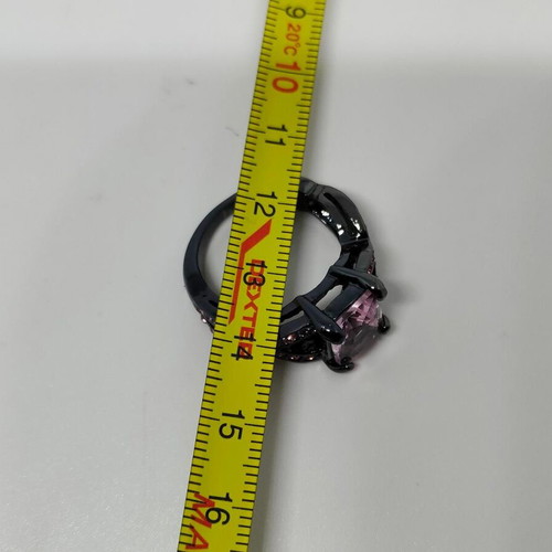 Ring with pink crystal and black base like new