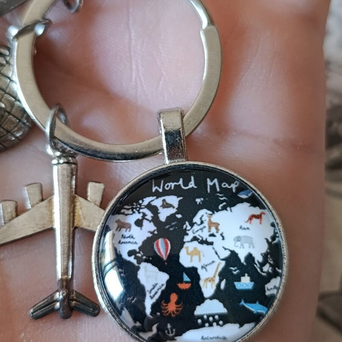 Travel keychain with world map design