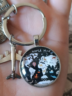 Travel keychain with world map design
