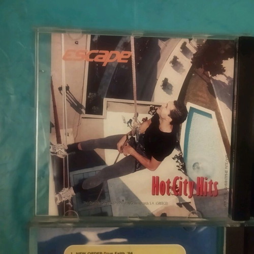 Escape Hot City Hits and Snow Motion Music CDs like new