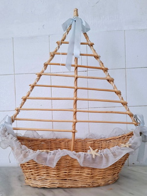 Large wicker basket in sailboat design used