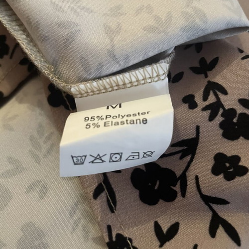 Women's blouse medium/large, beige with black floral pattern