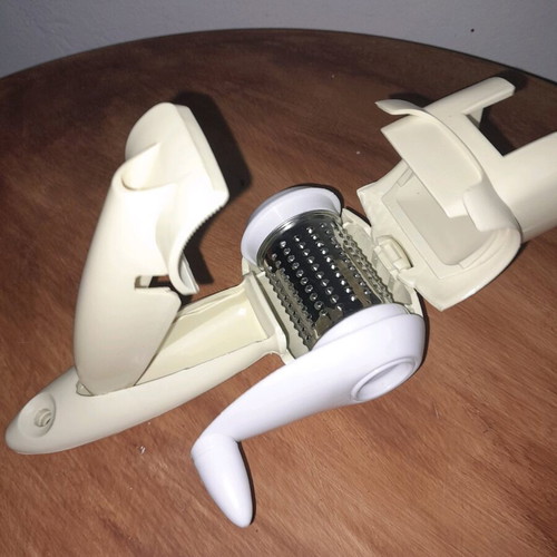 Hand-held grater new with plastic casing and inox wheel