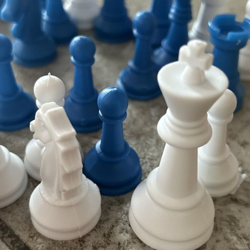 Vintage blue and white plastic chess pieces set