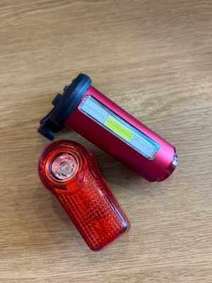 LED bicycle lights, one with 3 color modes