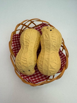 Salt and pepper set shaped like a peanut like new, missing one lid
