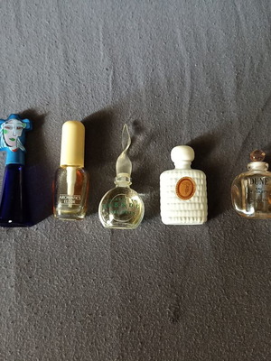 Authentic miniature perfumes used, some empty, some partially full