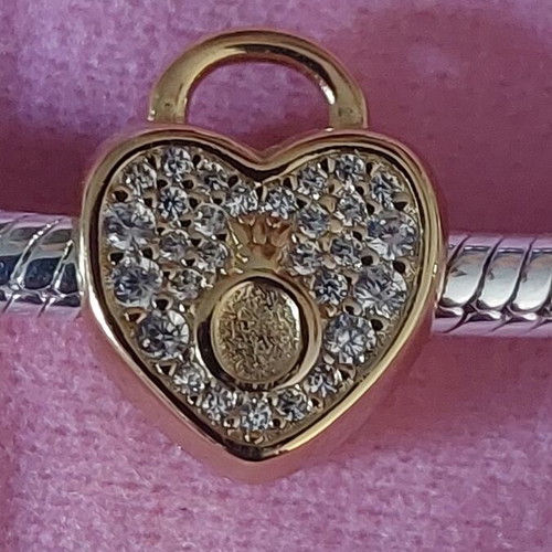 Charm stopper heart new, gold color with white zirconia and Pandora logo
