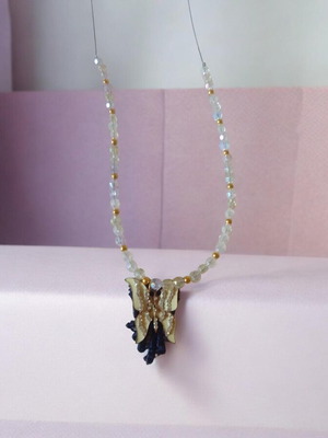 Handmade necklace with beads and butterfly
