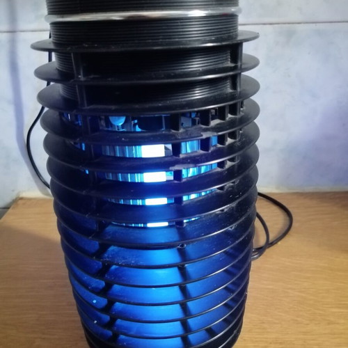 Electric insect trap used, black color, fully functional