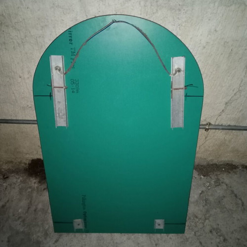 Semi-circular bathroom mirror used with 2 lights and shelf